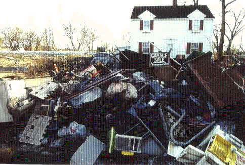 "Garage Sale." Such signs became a common form of graveyard humor in flooded neighborhoods.