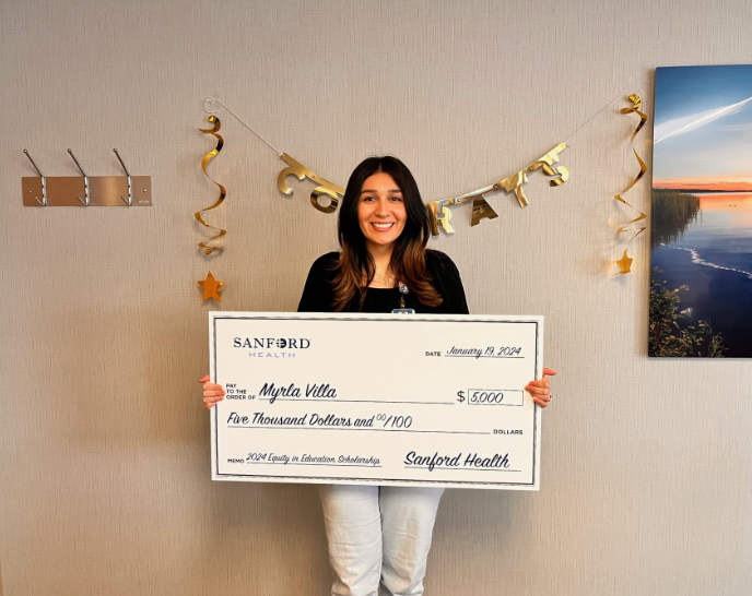 Myrla Villa with large scholarship check